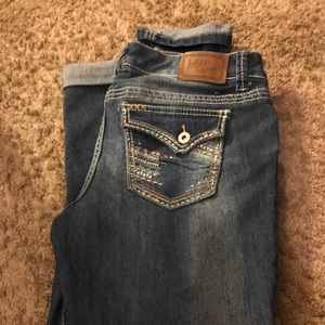 Blue Fitted jeans with the bottoms rolled up